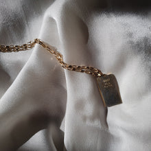 Load image into Gallery viewer, the back side of the pendant