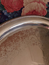 Load image into Gallery viewer, corner of silver tray on floral sofa