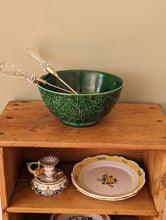 Load image into Gallery viewer, green majolica bowl with serving tongs on wooden shelf