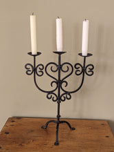 Load image into Gallery viewer, black metal candlestick holder on wooden shelf