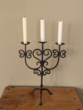 Load image into Gallery viewer, black metal candlestick holder on wooden shelf