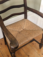 Load image into Gallery viewer, close up of rush ladder back rush seat on wooden floor