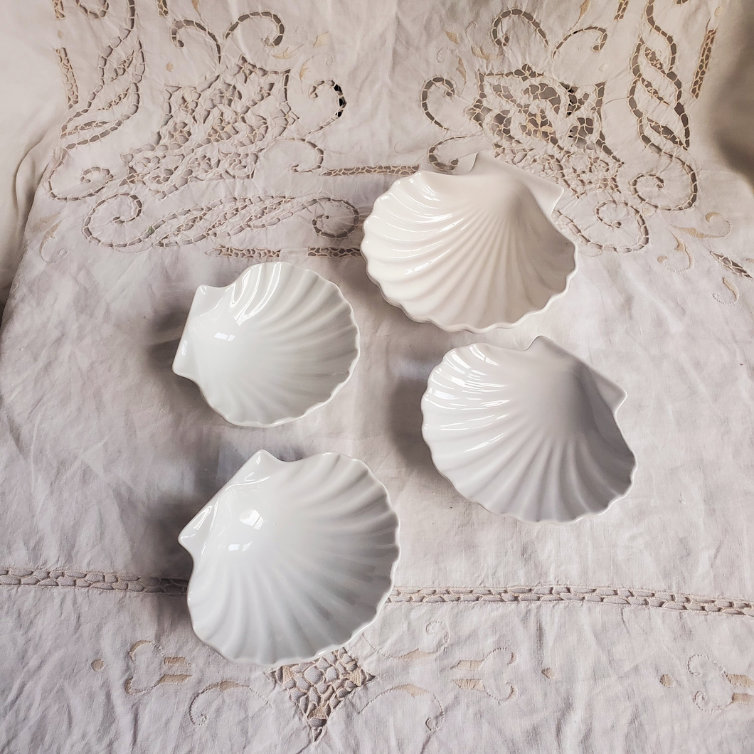 Set of four ceramic shell dishes