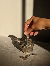 Load image into Gallery viewer, A heavy silver oyster dish with spoon

