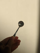 Load image into Gallery viewer, A heavy silver oyster dish with spoon
