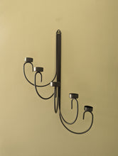 Load image into Gallery viewer, A pair of black metal tealight wall sconces
