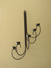 Load image into Gallery viewer, A pair of black metal tealight wall sconces
