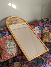 Load image into Gallery viewer, cane and bamboo mirror on floral sofa
