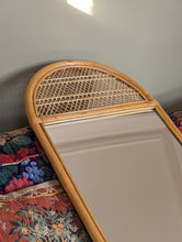 Load image into Gallery viewer, cane and bamboo mirror on floral sofa
