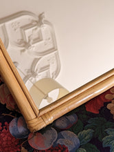 Load image into Gallery viewer, cane and bamboo mirror on floral sofa
