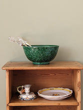 Load image into Gallery viewer, green majolica bowl with serving tongs on wooden shelf
