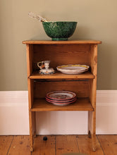 Load image into Gallery viewer, green majolica bowl with serving tongs on wooden shelf

