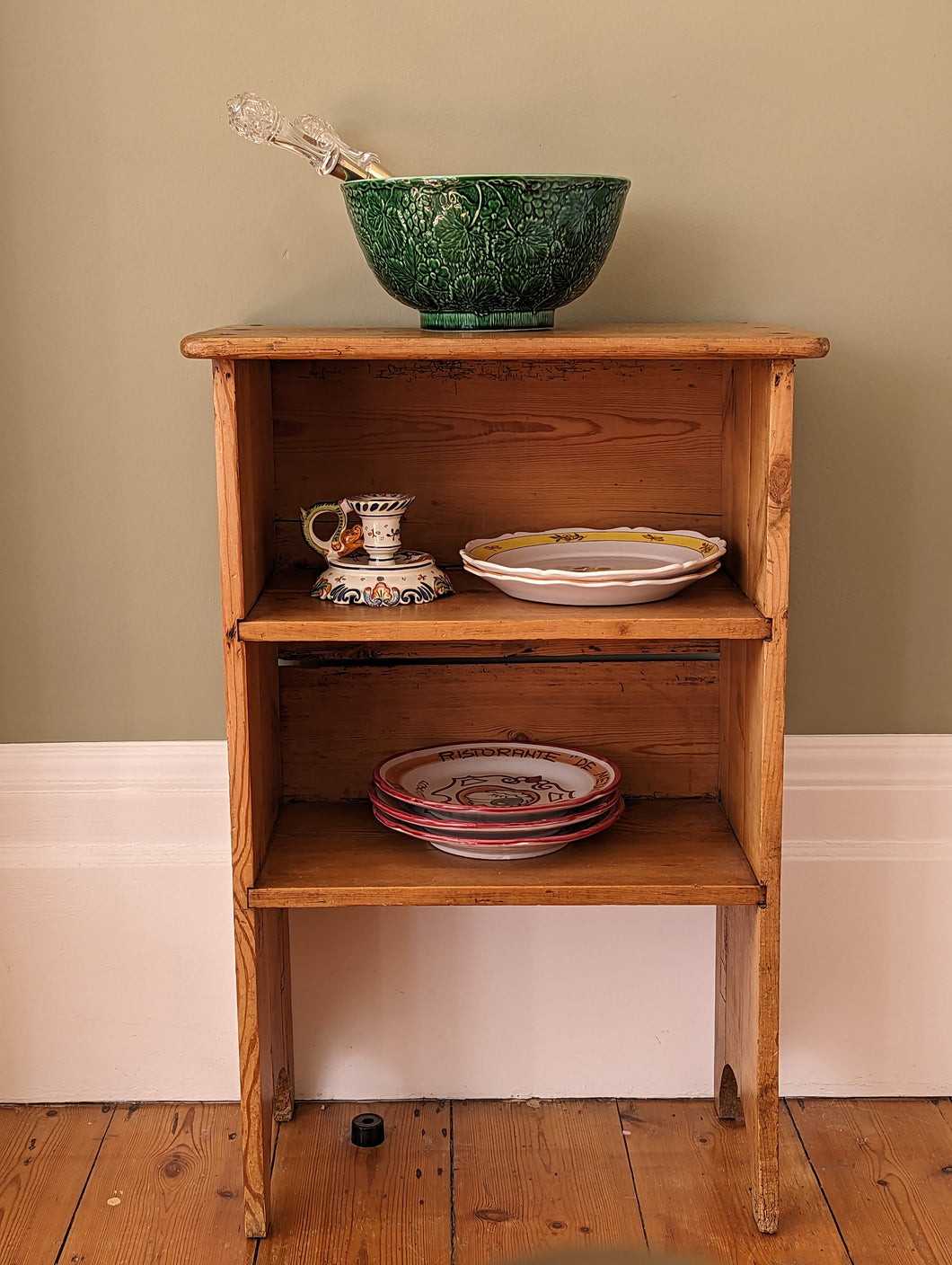 small pine shelf with crockery