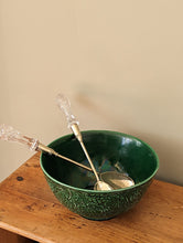 Load image into Gallery viewer, green majolica bowl with serving tongs on wooden shelf
