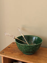 Load image into Gallery viewer, green majolica bowl with serving tongs on wooden shelf
