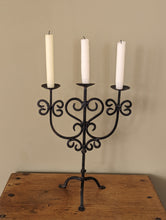 Load image into Gallery viewer, black metal candlestick holder on wooden shelf
