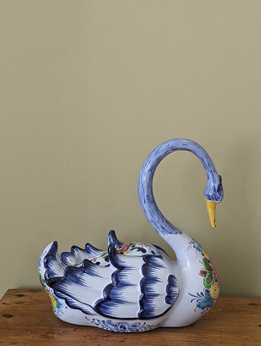 large colourful ceramic swan planter on bench