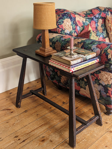 rustic bench stool with lamp candle and books